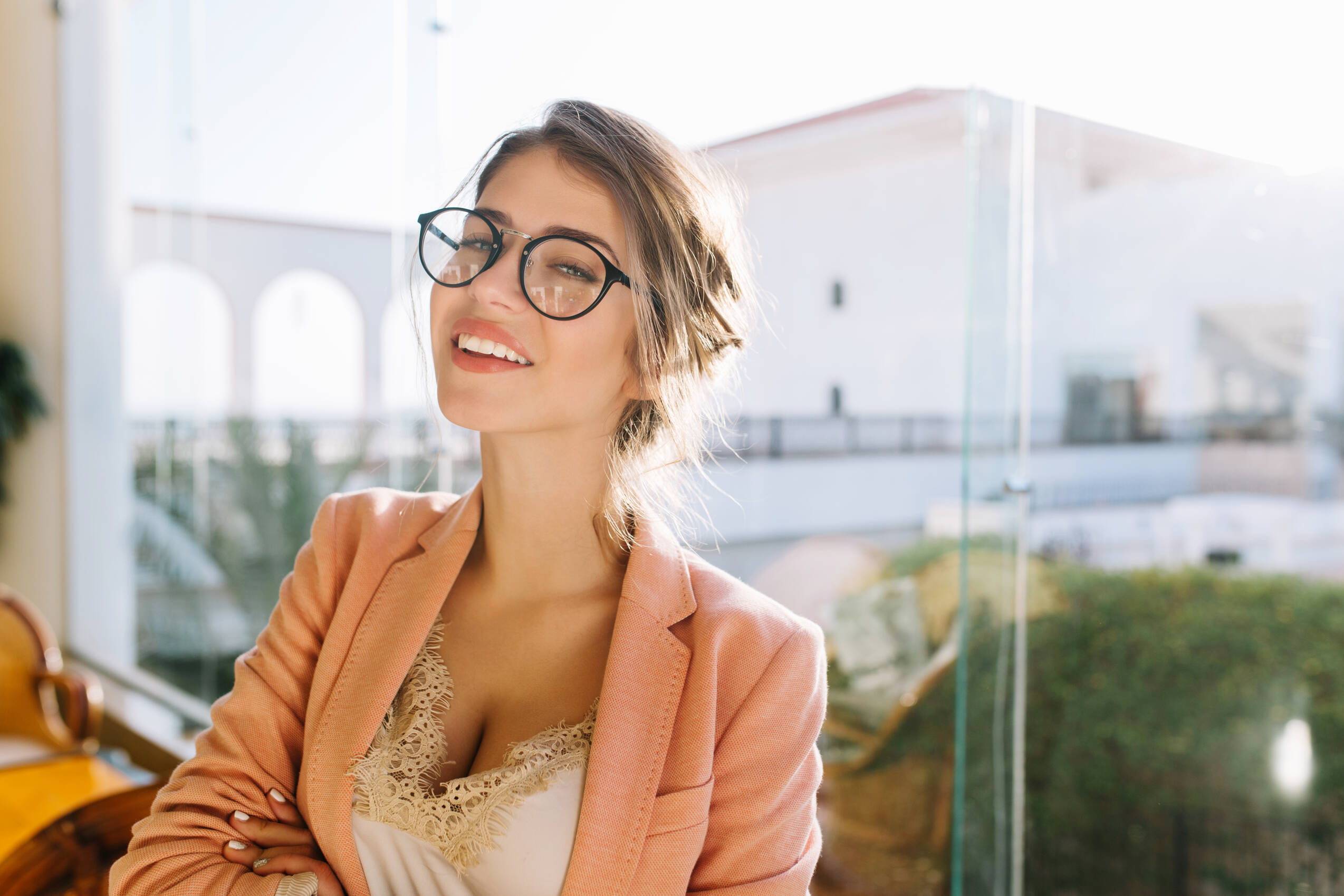 Closeup portrait young woman wearing stylish glasses smart lady elegent pink jacket with beige blouse cute student big window with nice view